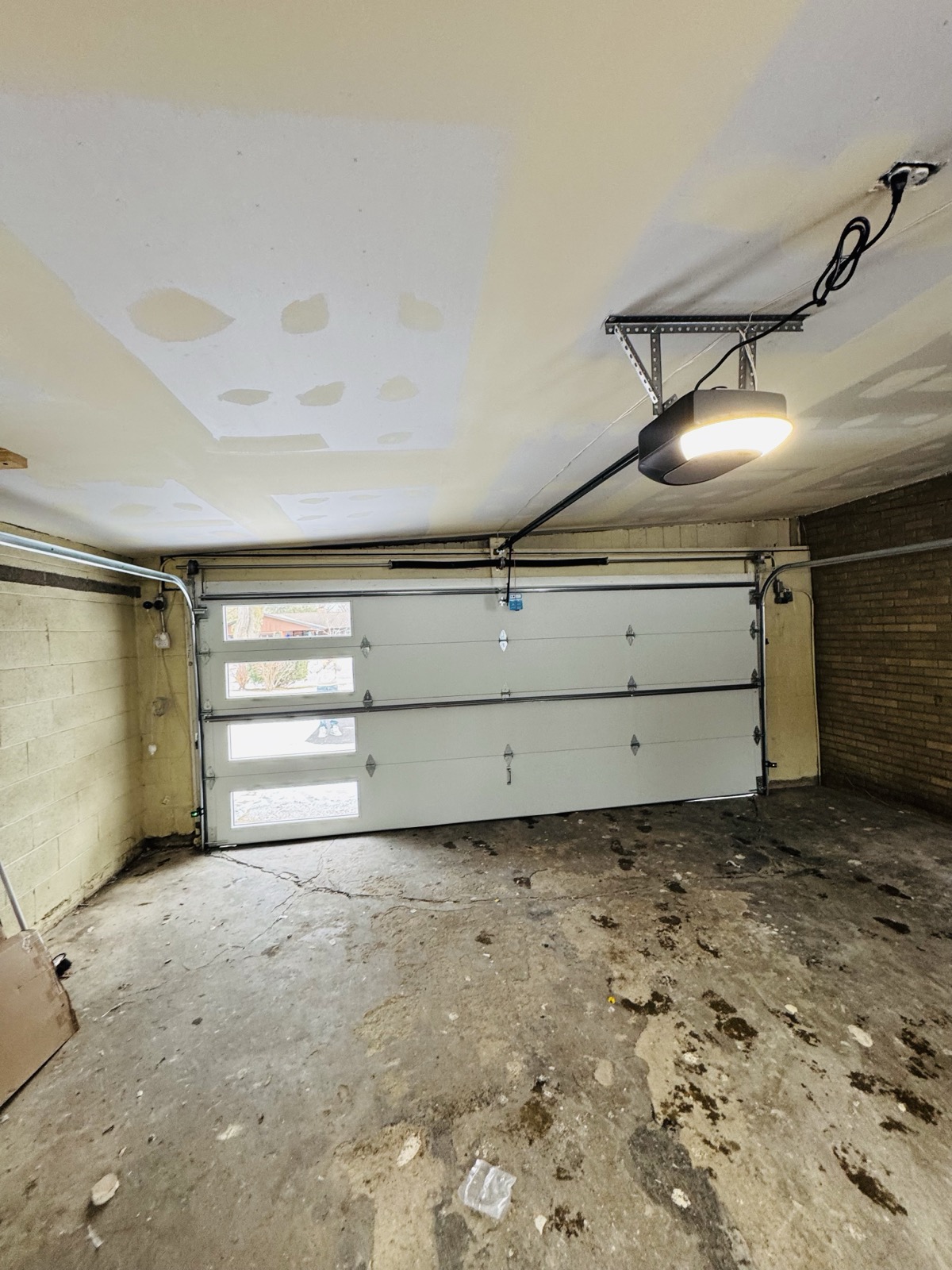 Garage door with window inserts viewed from inside a residential garage